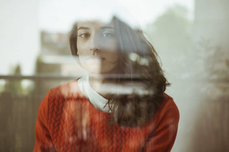 Young woman with IBD dealing with depression