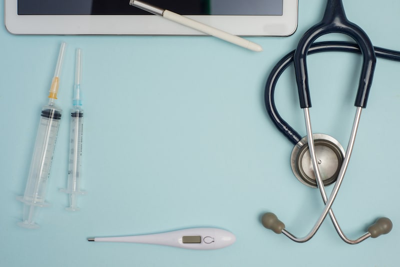 syringes, stethoscope, and more for diagnosis and questions for gastrointestinal specialists